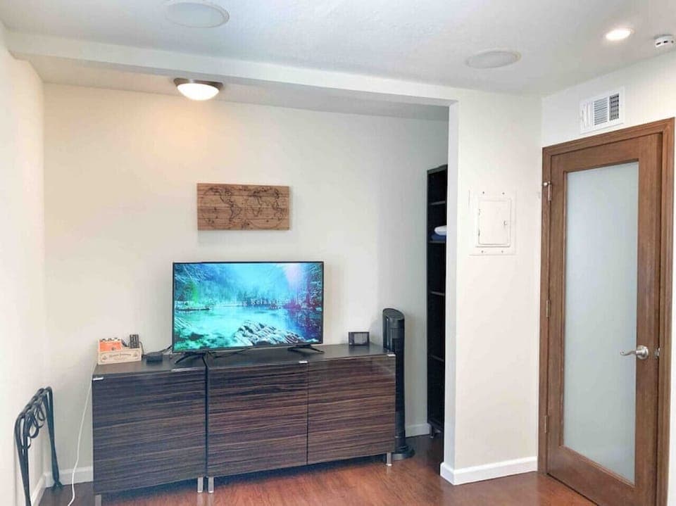 Bedroom #2 has storage space and a TV.