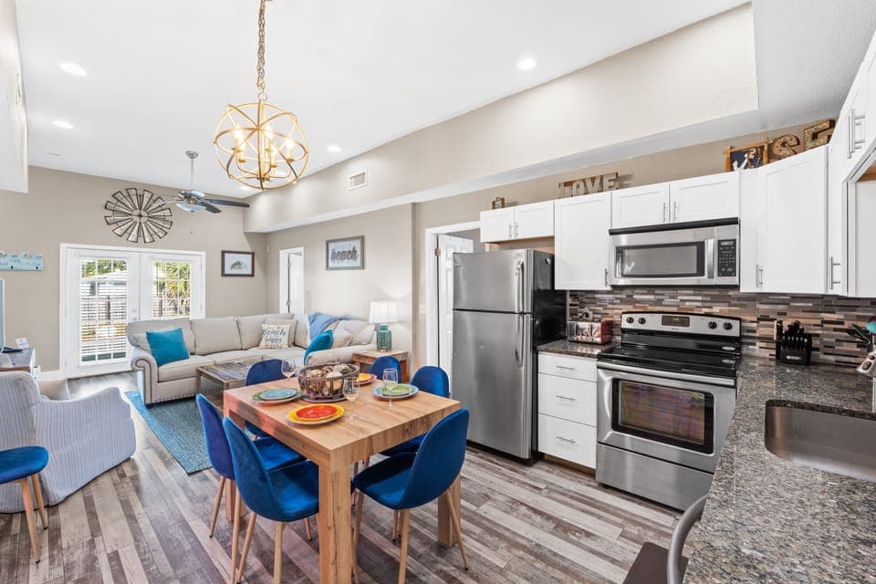 Fully Stocked Kitchen and Dining Area