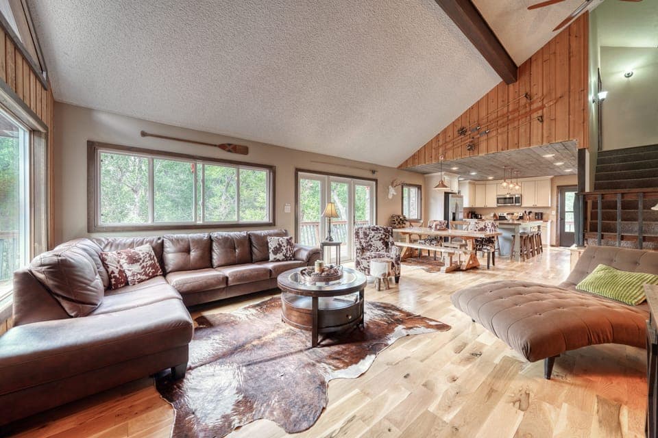 Large open-concept living room with fireplace and TV with streaming capabilities.