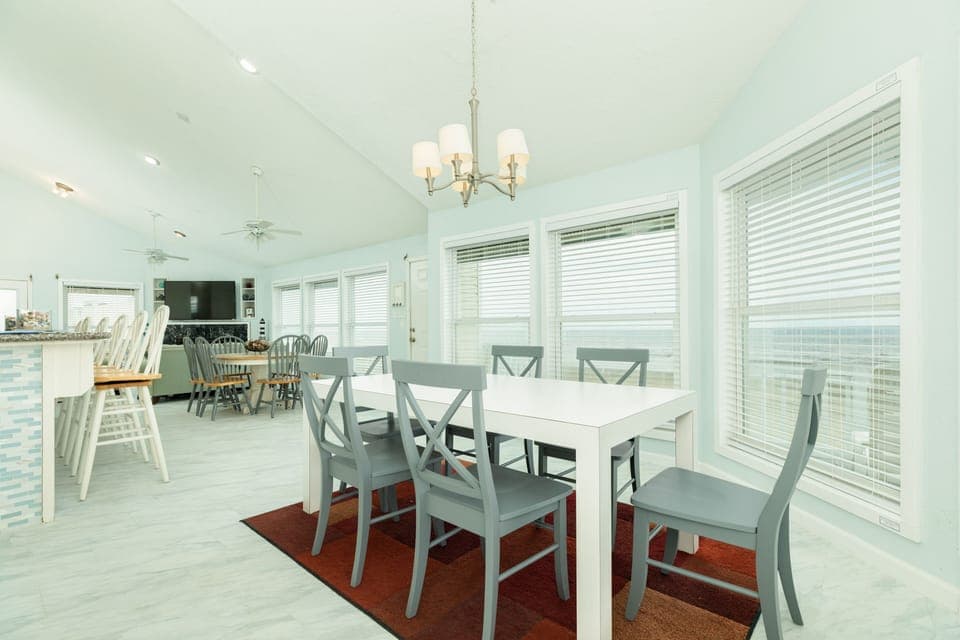 Enjoy meals overlooking the Gulf from two dining tables - sure to fit the whole group!