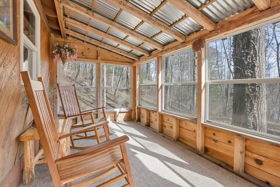 Sunroom with a view of the woods