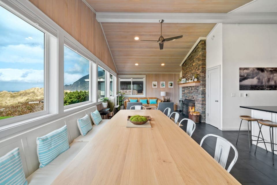 A huge oak dining table holds your entire family for meals with a view.