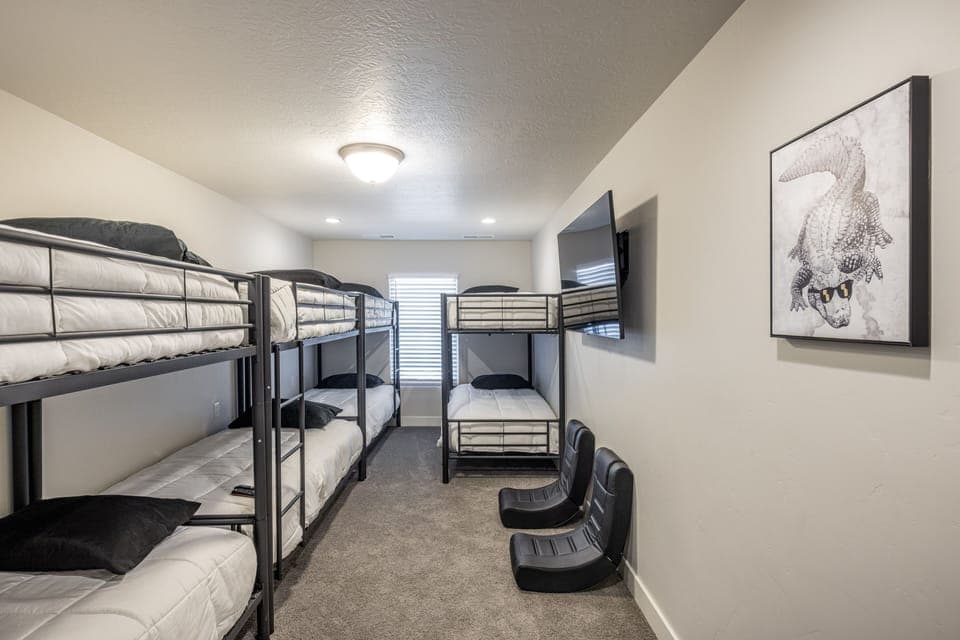 Bedroom 5 - Bedroom 5 is a large bedroom which includes four Twin over Twin bunkbeds and private TV.