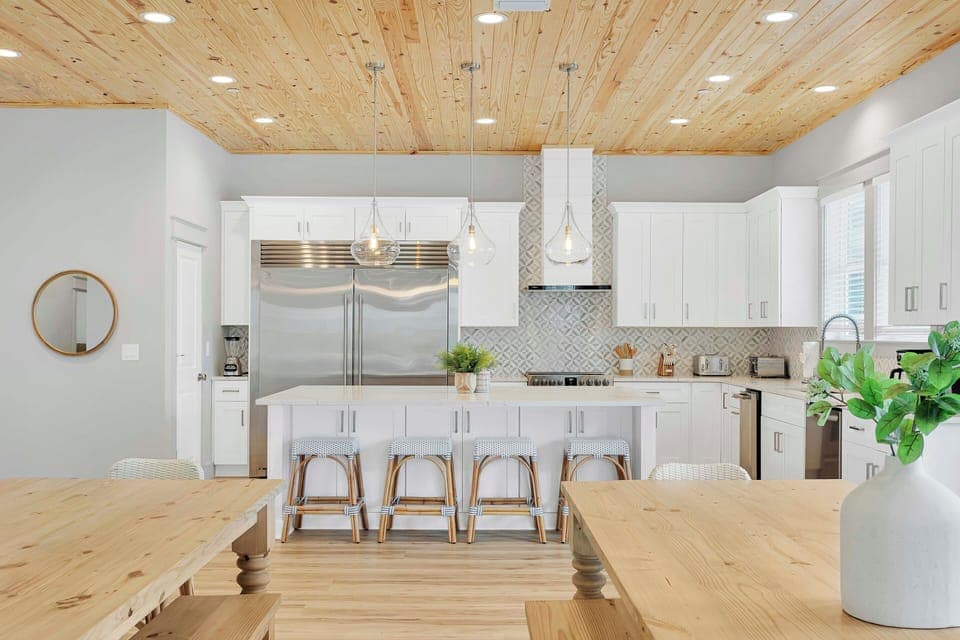 The crisp white tones of the kitchen make this a refreshing, inviting space.