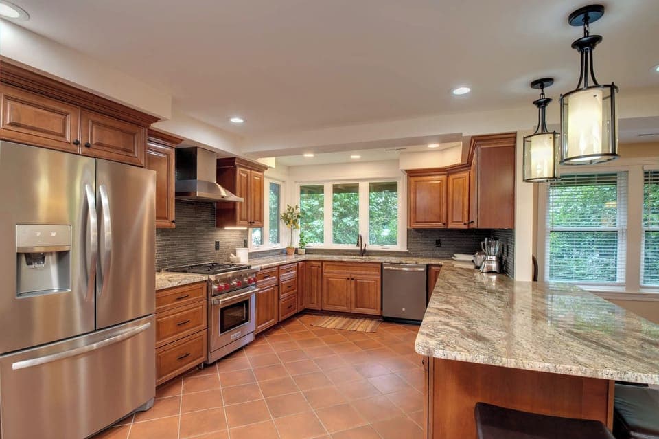Amazing chefs kitchen with Wolf stove and granite counters!