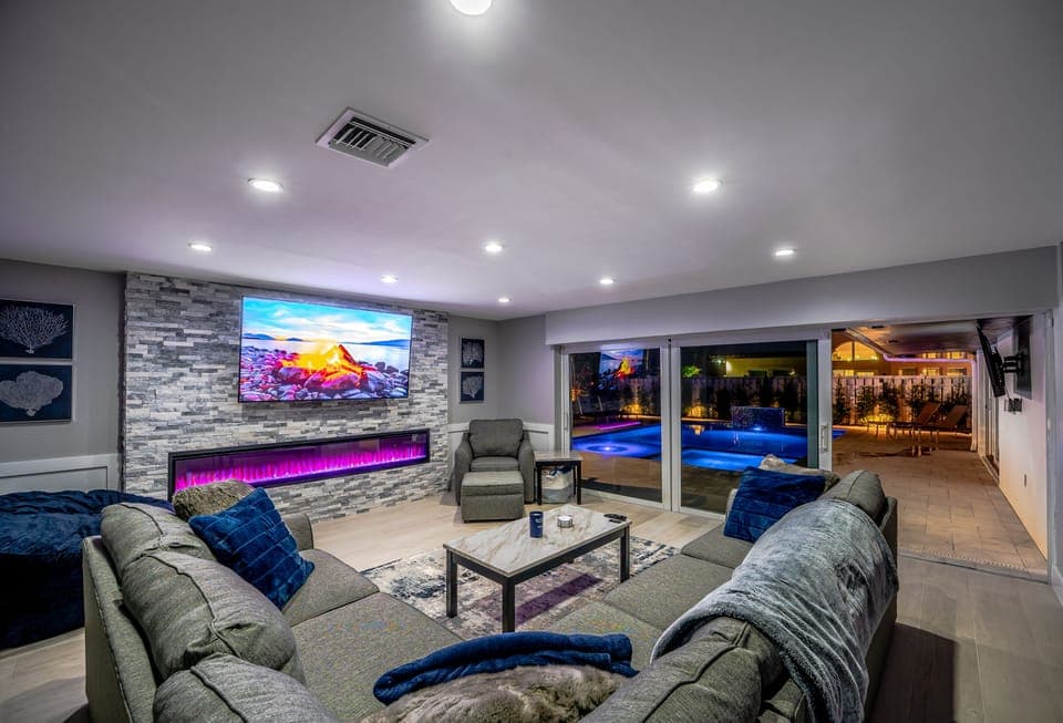 Living Room w/ 75" Smart TV & Electric Fireplace