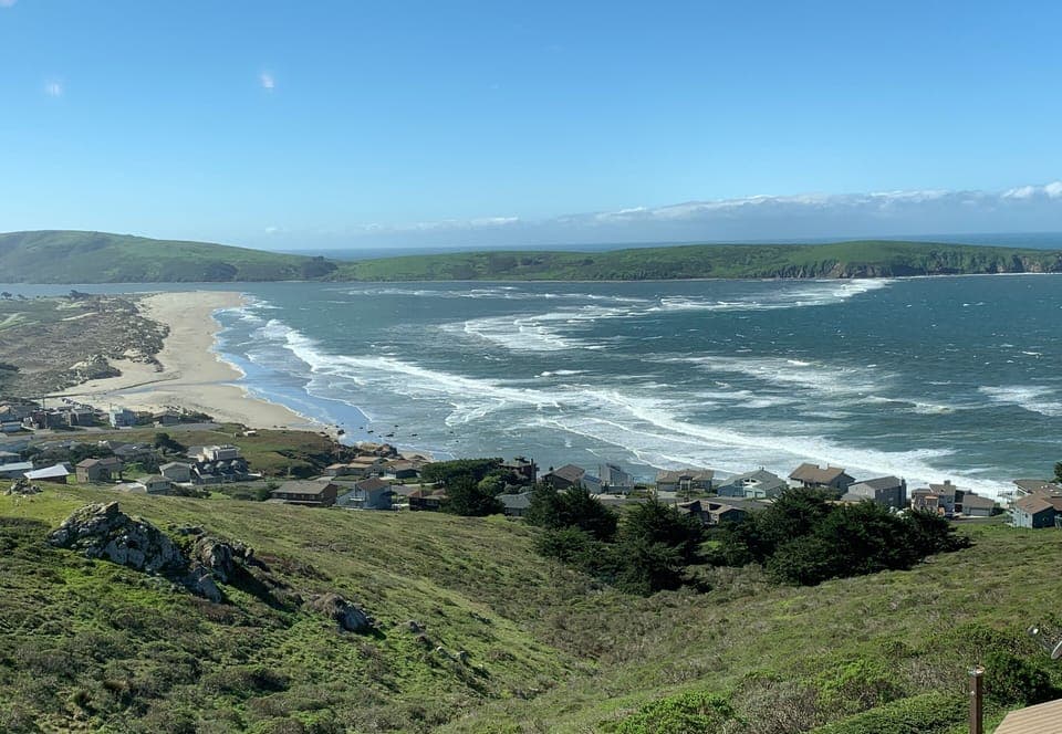 Farol views! From great room, decks and lower front bedrooms