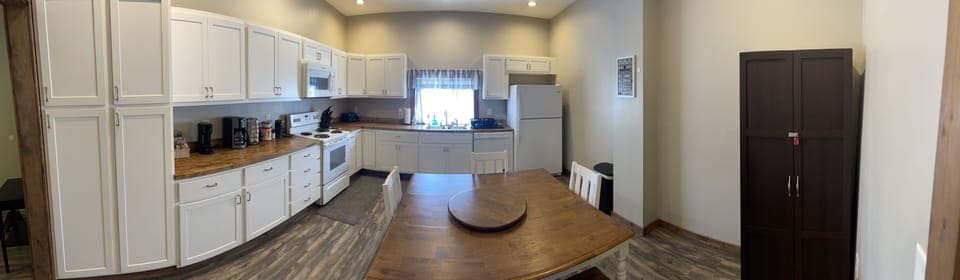 Nice large kitchen with dining table that comfortably seats 6+ people.