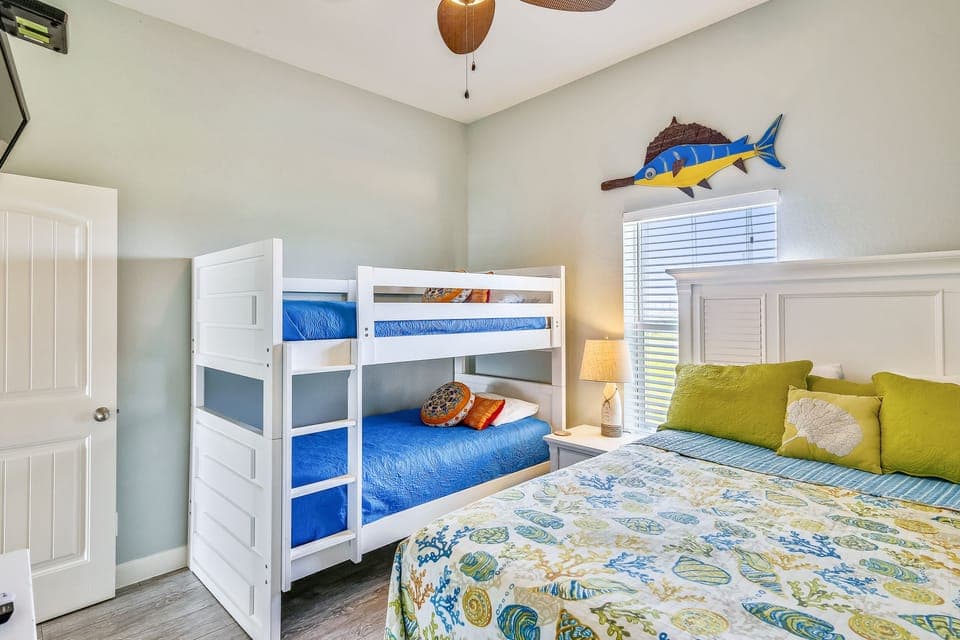 Sleep soundly after a full day at the beach! - Nothing makes for a good night's sleep like a day at the beach! Kids and guests will love the choice of a bunk bed or queen mattress in this bedroom. Let the soothing decor lull you to sleep.
