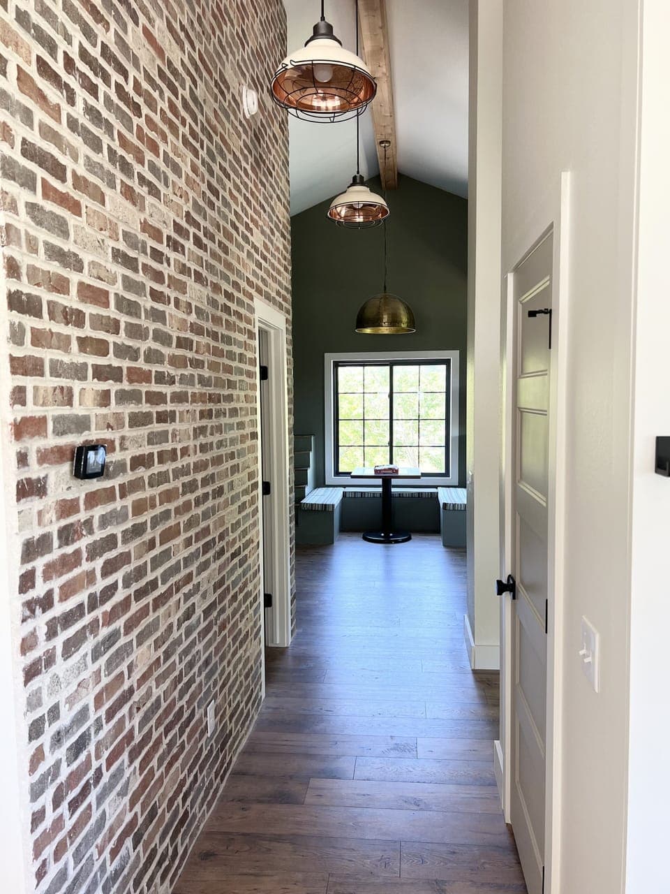 Stone, brick, and shiplap throughout house. 