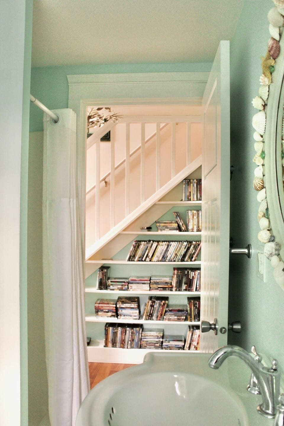 Main house bathroom with tub, shower -  leading to hallway & DVD collection