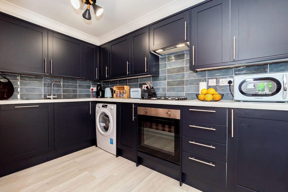 Contemporary style and efficiency meet in this beautiful kitchen, well stocked with all the basics 