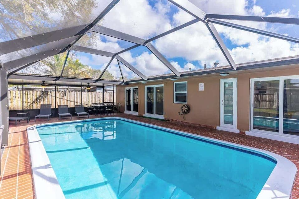 "Spacious front lawn, mature trees, and cozy curb appeal—welcome to your relaxing vacation retreat!"
