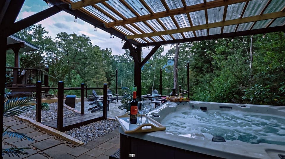 Unwind in the spa-like hot tub or gather by the custom flagstone firepit