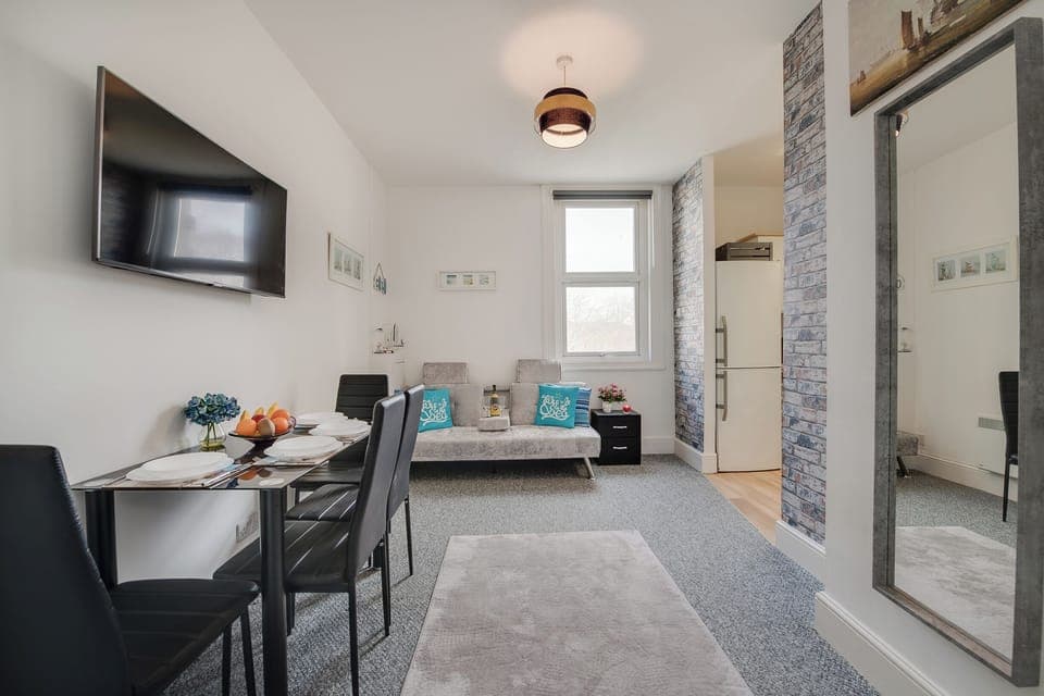 Living Room Retreat: Bright and airy space with stylish decor, perfect for relaxation or dining!