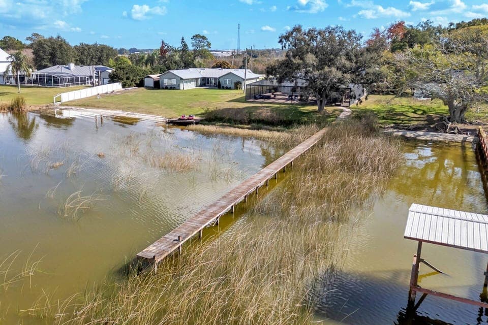 Private dock and serene shoreline offer the ultimate lakefront experience for fishing, kayaking, or enjoying the view.