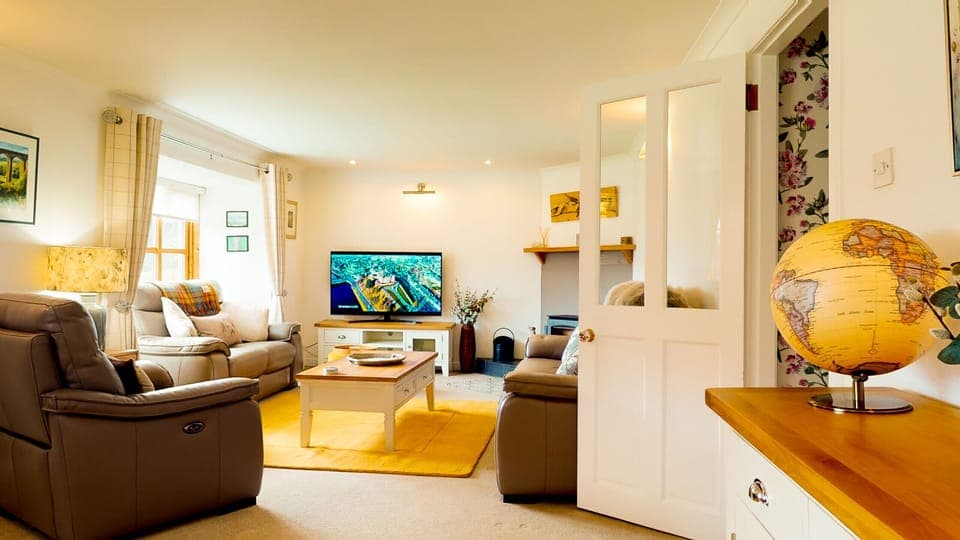 Relax in the cosy lounge with luxury furnishings and log burner