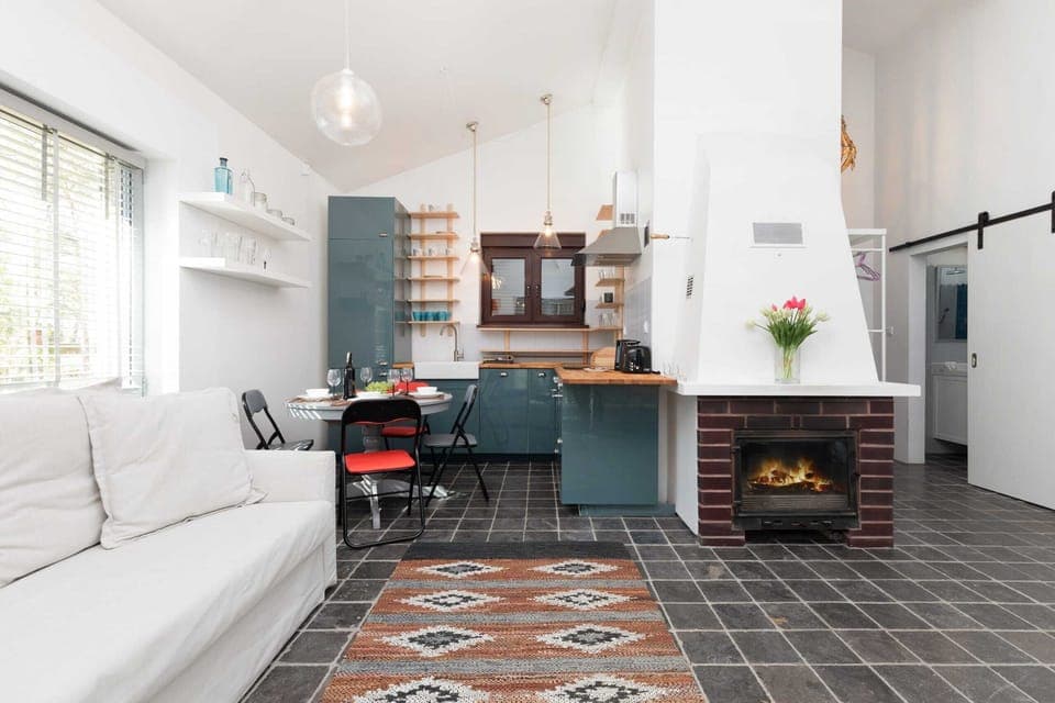 The sleek design of the kitchenette blending seamlessly with the living area.