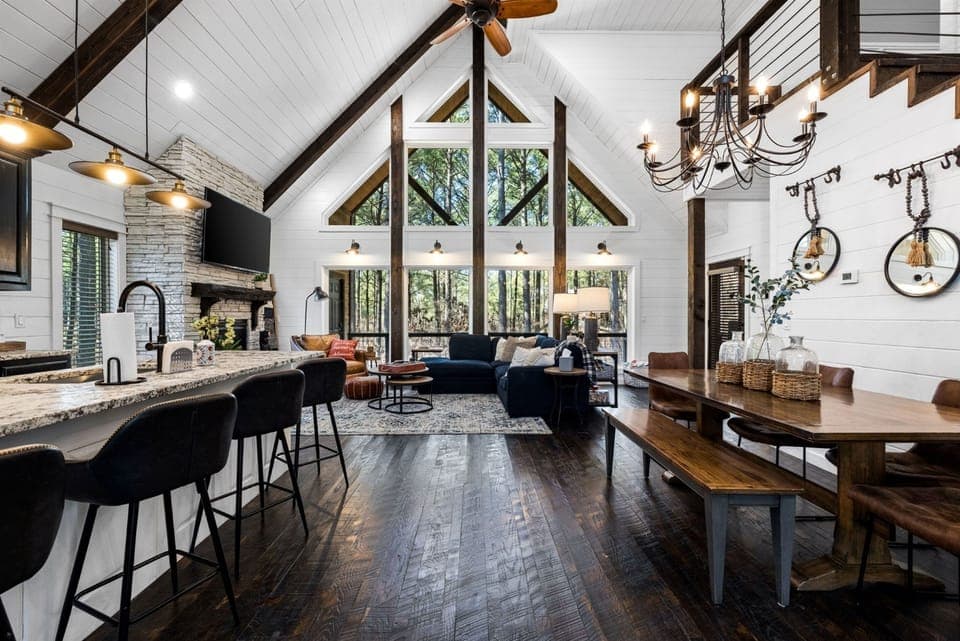 Absolutely breathtaking views of towering pine trees and gorgeous natural light greet you through floor-to-ceiling windows.