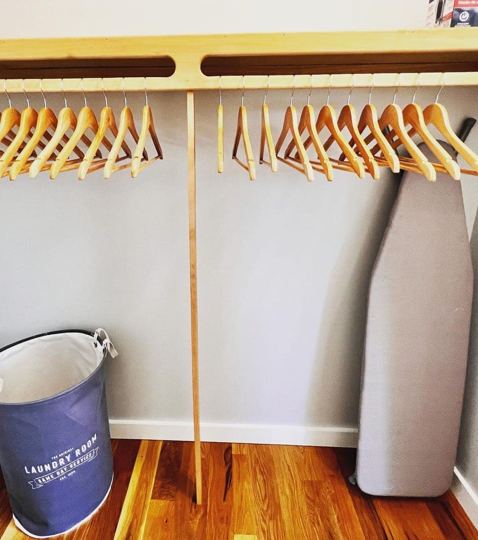Plenty of hangers in each closet, iron and ironing board in Master closet