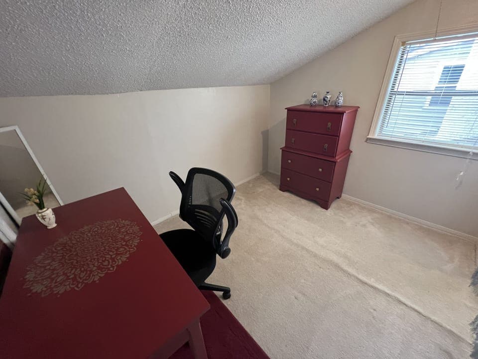 Dressing area with a vanity, could easily be used as a quiet office space also.
