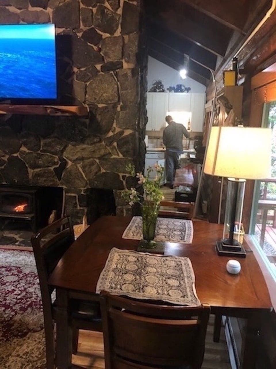 Dining room table for 4 in front of Northern window looking to botanical forest