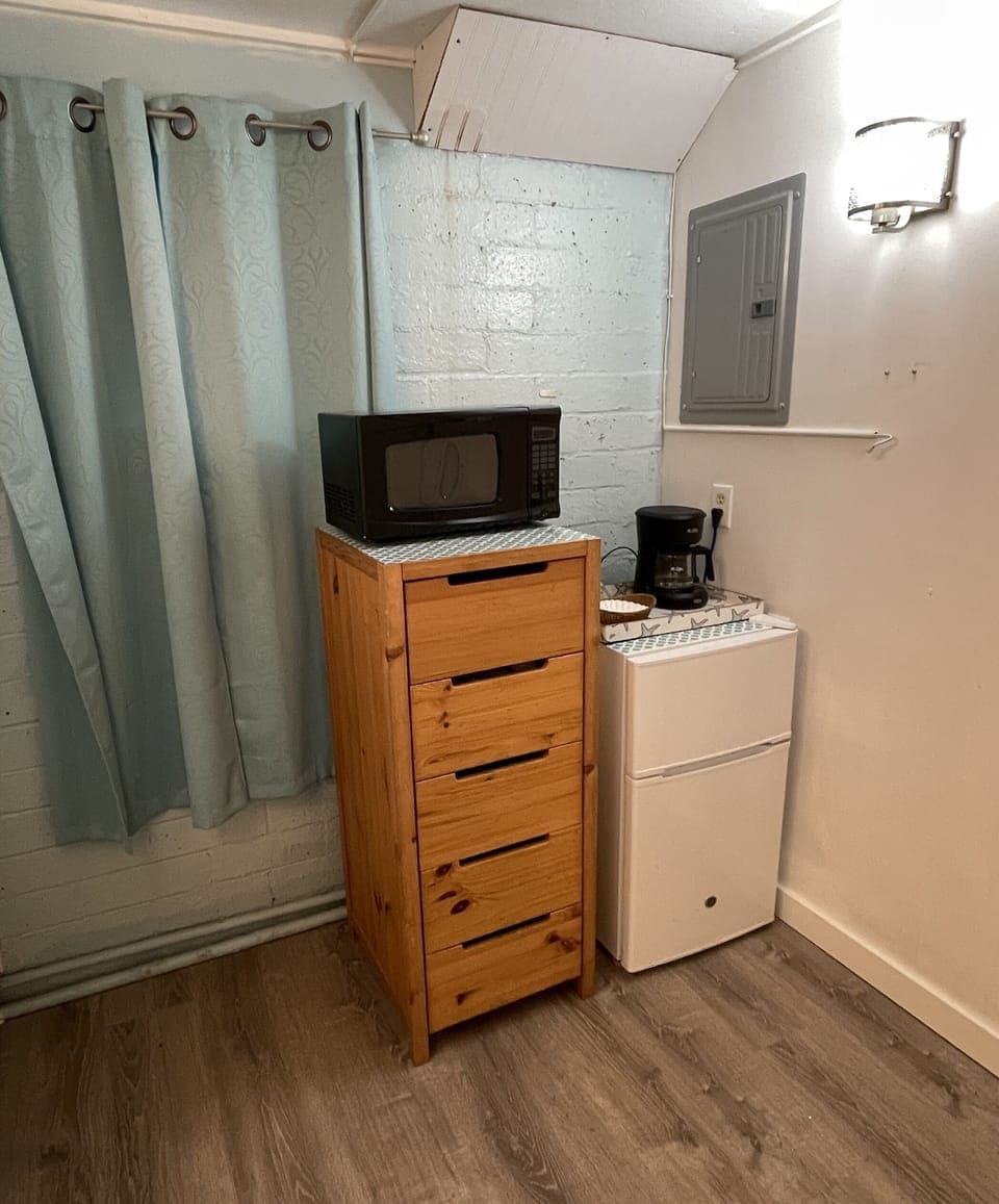 Handy fridge and microwave. Drip or cup style coffee maker, toaster available.