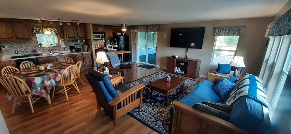 Open concept kitchen/dining/ living with big screen TV.  