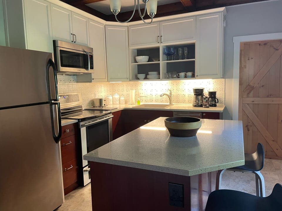 Three stools available at the island. 12 cup and 6 cup coffee pots!  Coffee too.