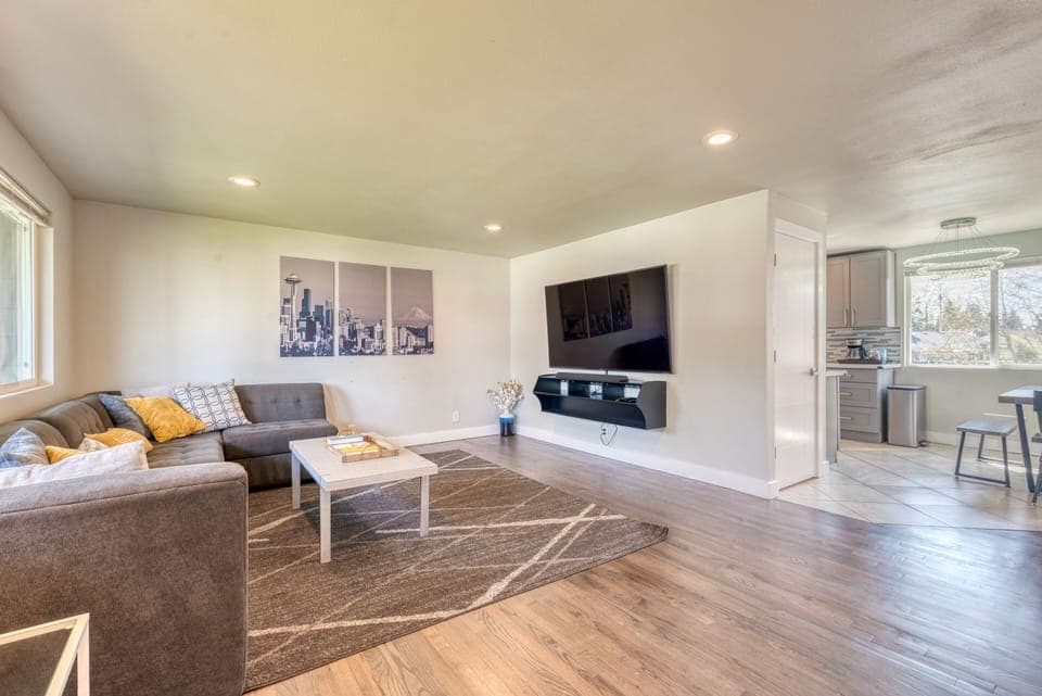 Welcome home! Spacious and open living room with big 75" Smart TV!