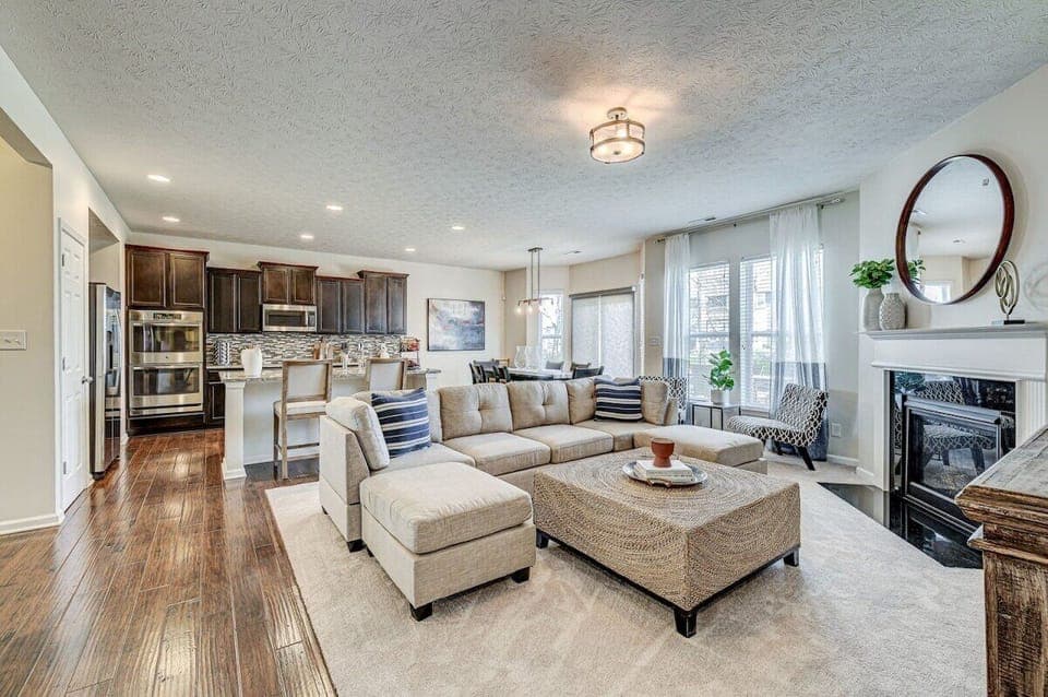 Spacious living room with gas fireplace.