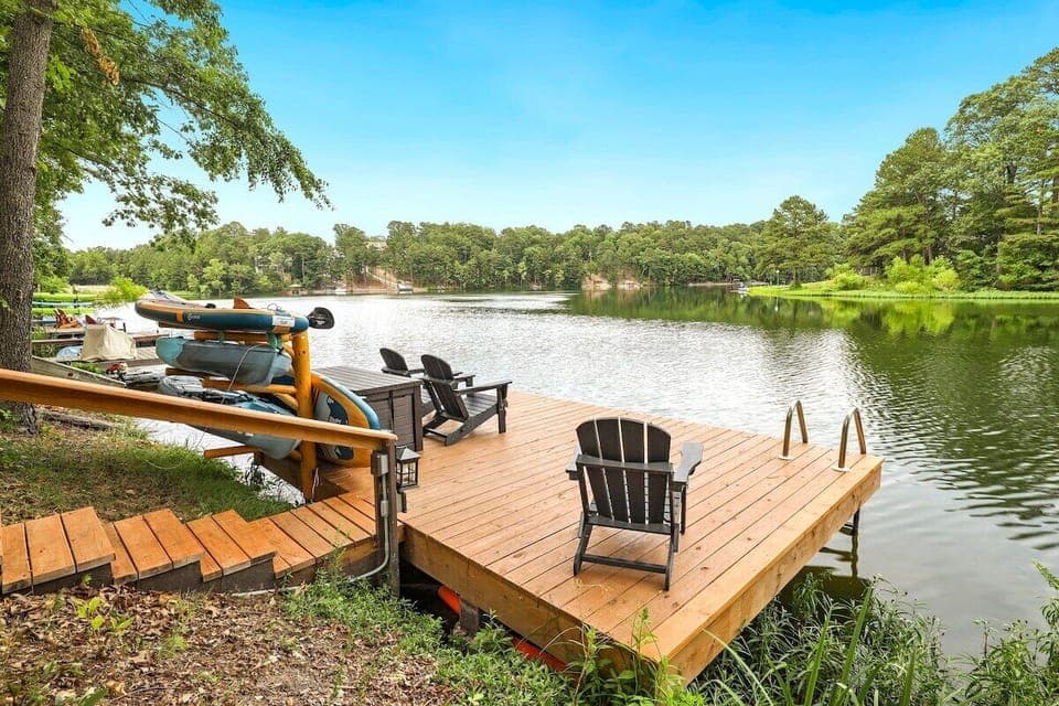 This area has lounge seating, two paddle boards, two kayaks, paddles and life jackets.