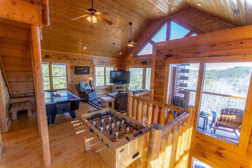 Enjoy foosball and air hockey in the upper living area/game room.