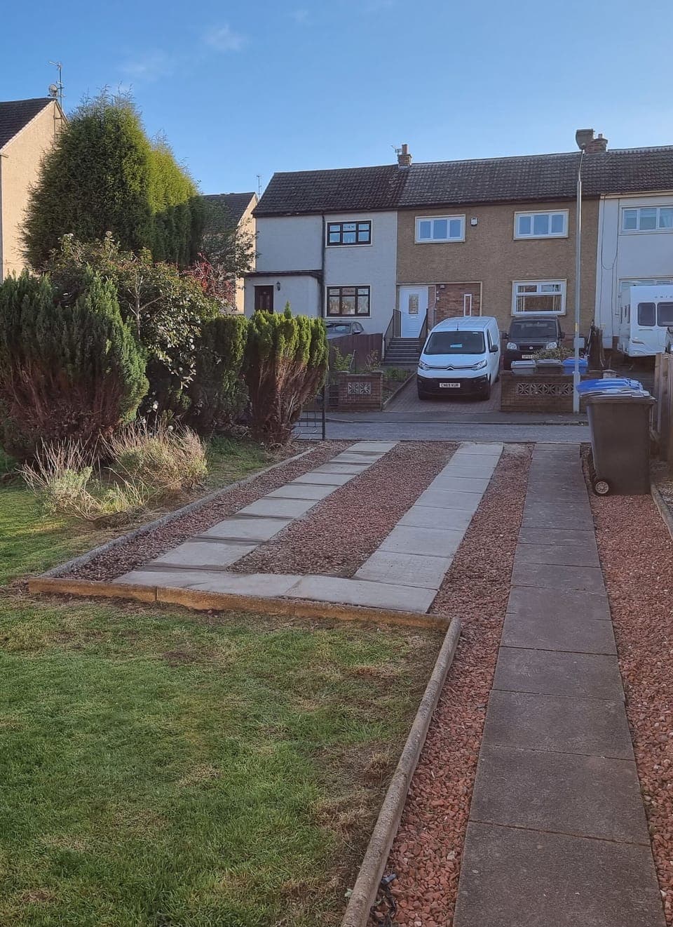 A view of the private driveway with space for one large or two small cars