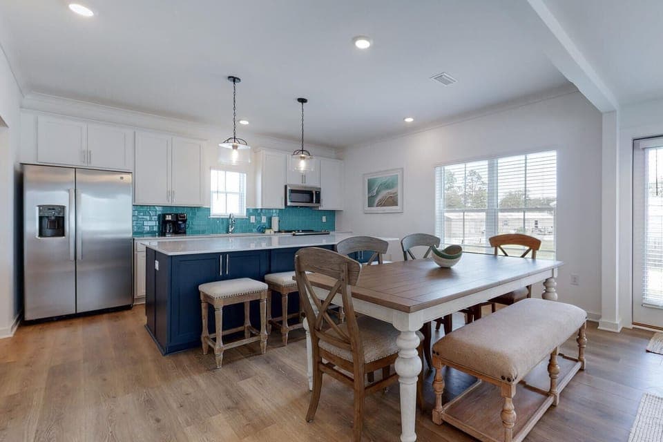 The kitchen seamlessly blends into the dining space, creating a gathering spot for cooking, eating, and entertaining. It's the perfect blend of comfort and functionality.