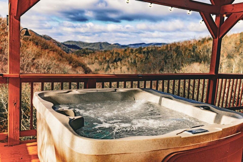 Elevate your cabin stay with a dip in our hot tub placed on the deck.