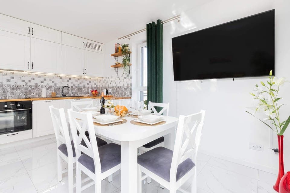 Large table with chairs for eating communal meals. 