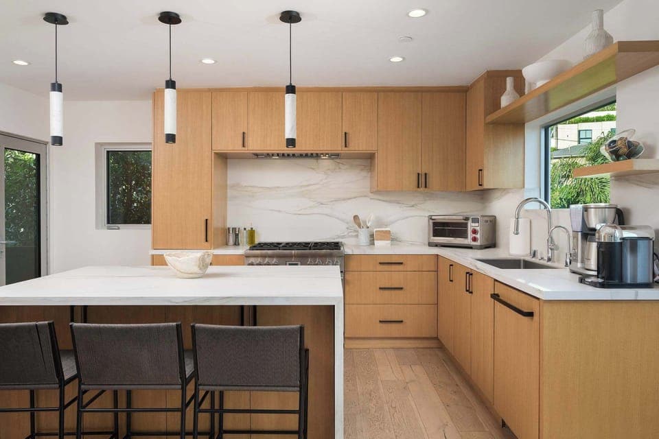 The large chefs kitchen with stainless steel appliances, tons of counter space and stunning views!