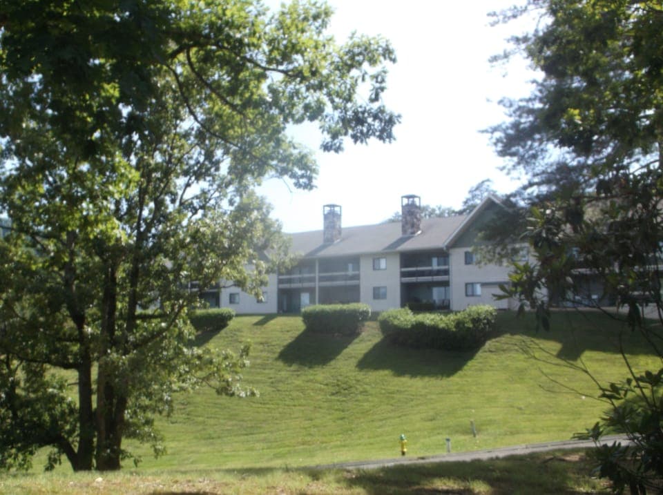 view of condos from pool area