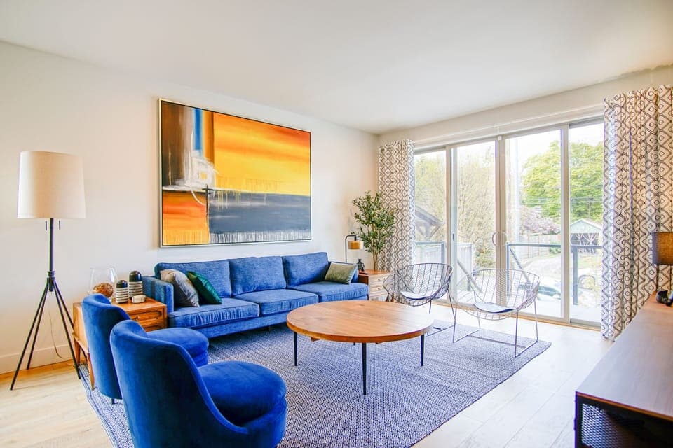 Architect designed interior has comfort, style, high ceilings and huge windows. 