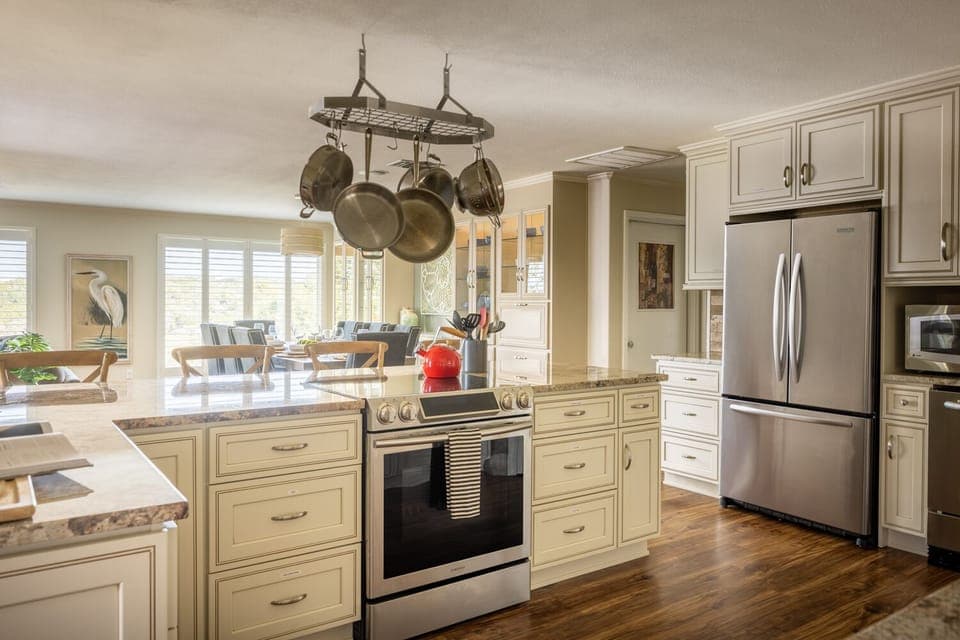 Natural light radiantly shines through the kitchen with canyon views. 