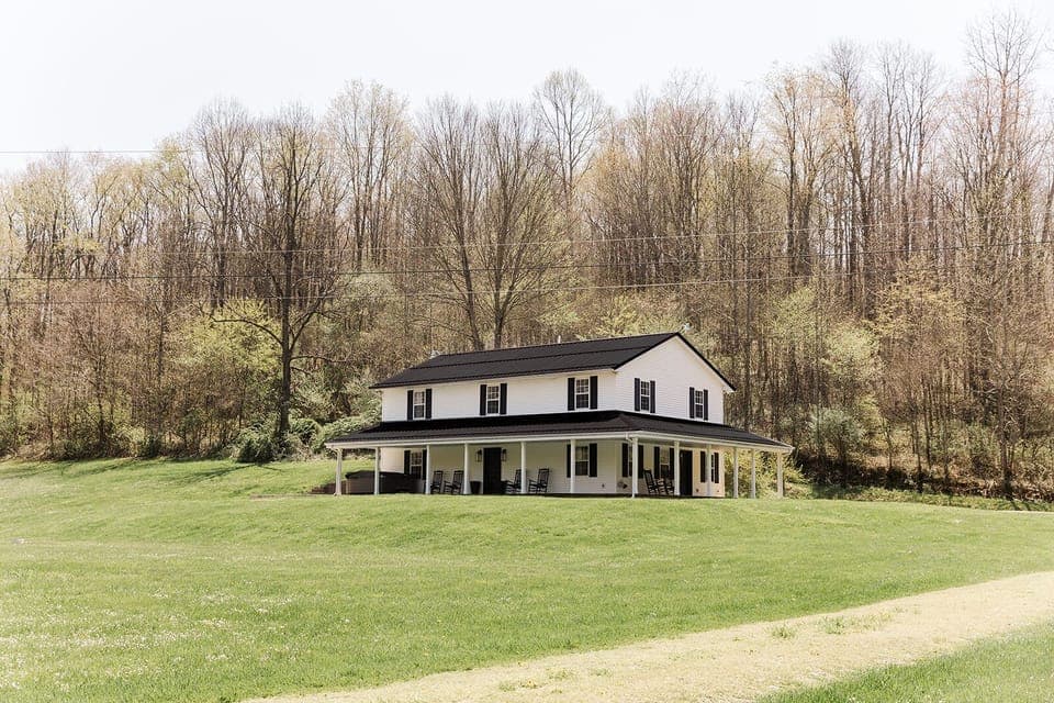 Fully covered porch with outdoor seating allows for hours of outdoor enjoyment.