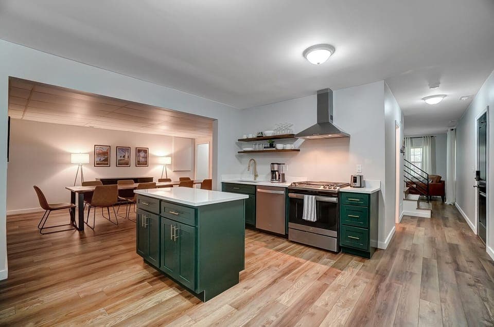 Kitchen with quartz countertops and stainless steel appliances.