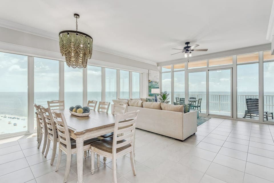 Living/Dining Room with amazing views of the Gulf. Electric blinds for privacy