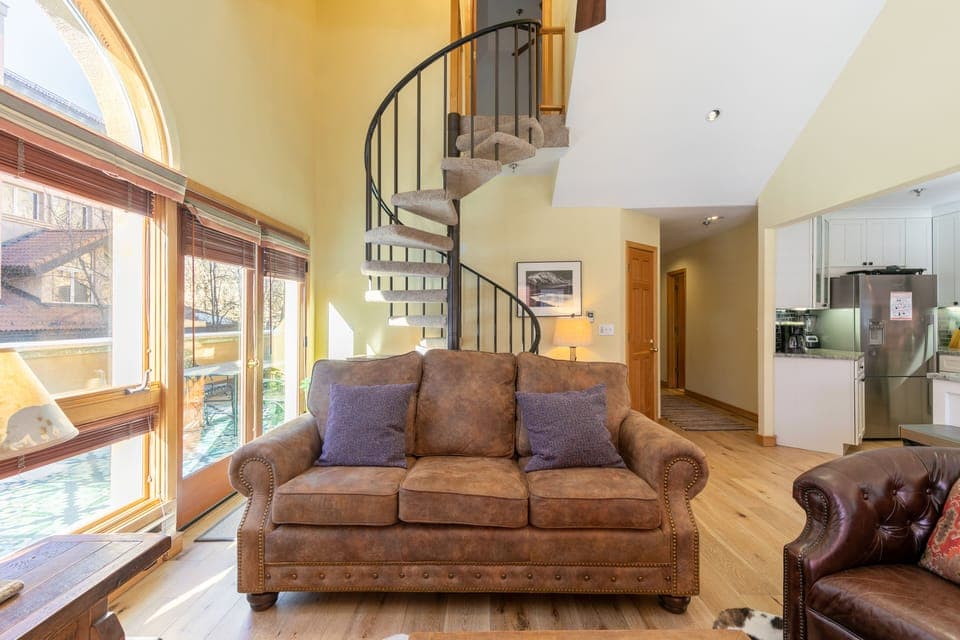 Spiral staircase to the upper level.