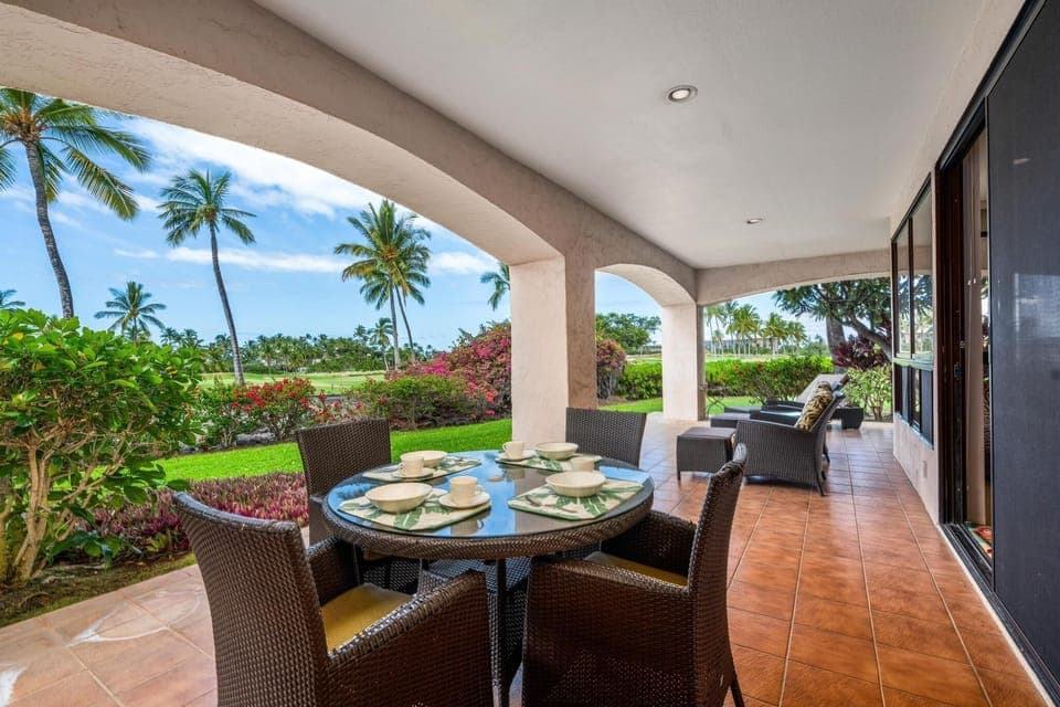 Covered lanai with dining table and loungers