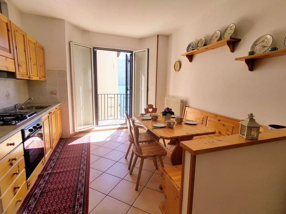 Cabinetry, Property, Furniture, Countertop, Table, Window, Interior Design, Wood, Lighting, Kitchen