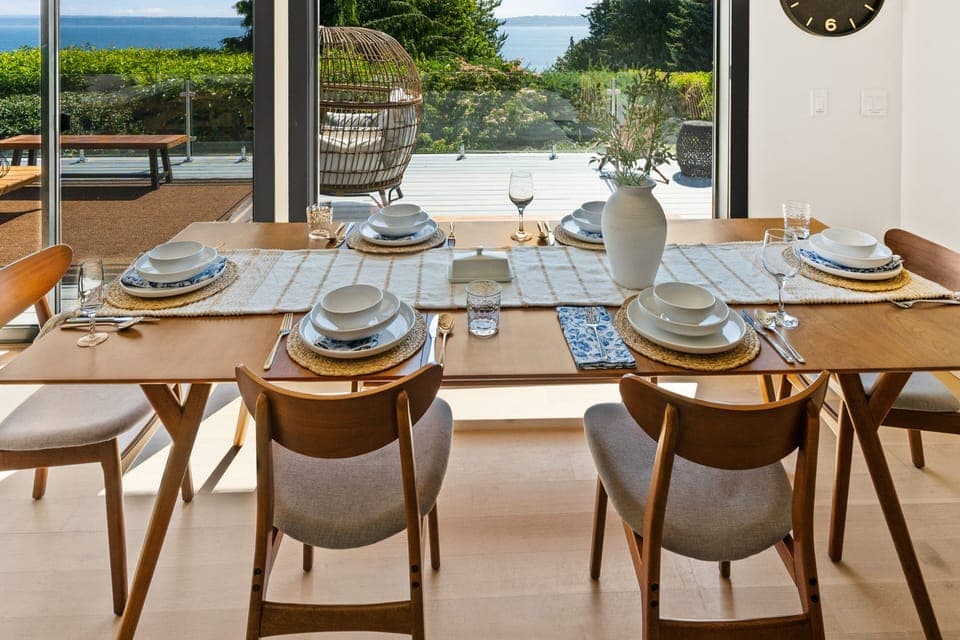 Enjoy the view while dining on West Elm dining table with seating for 6.
