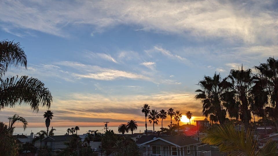 Enjoy sunset views from our top floor living room, dining room, kitchen & patio 