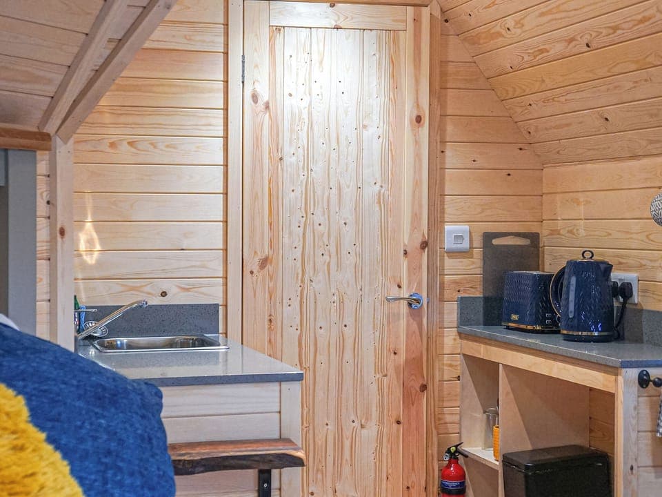 Kitchen area | Cwt Celyn (Holly Hut) - Mountain Meadow Cabins, Abergele